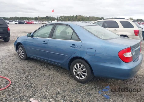 2003 Toyota Camry Le z USA, uszkodzony, nr VIN JTDBE32K030236131